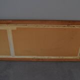 wall mirror in a decorative wooden frame.