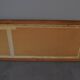 wall mirror in a decorative wooden frame.