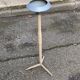 Vintage ashtray on a beige and grey metal stand.
