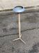 Vintage ashtray on a beige and grey metal stand.