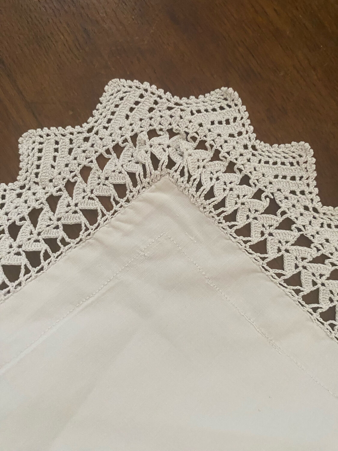 Antique white cotton pillowcase with crochet and monogram.