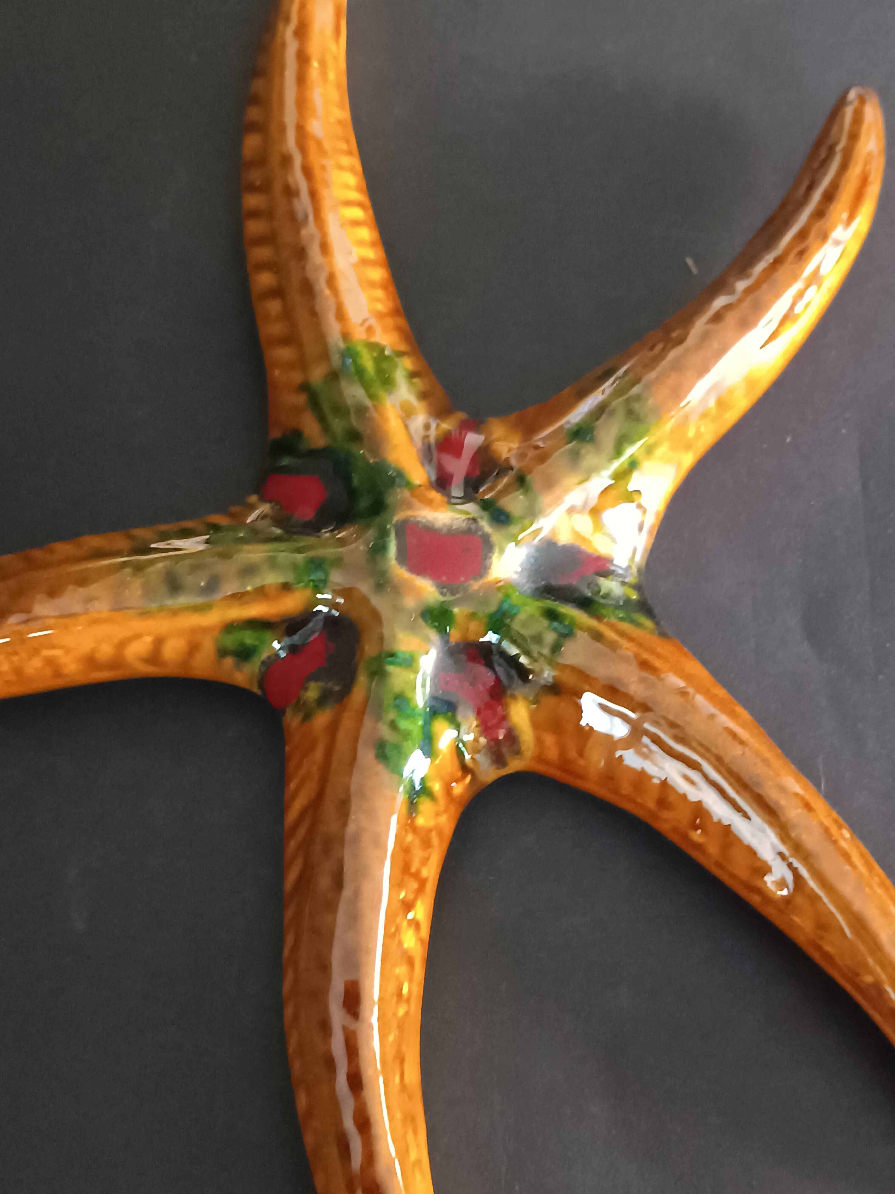 Two vintage ceramic wall pots featuring a seahorse and a starfish.