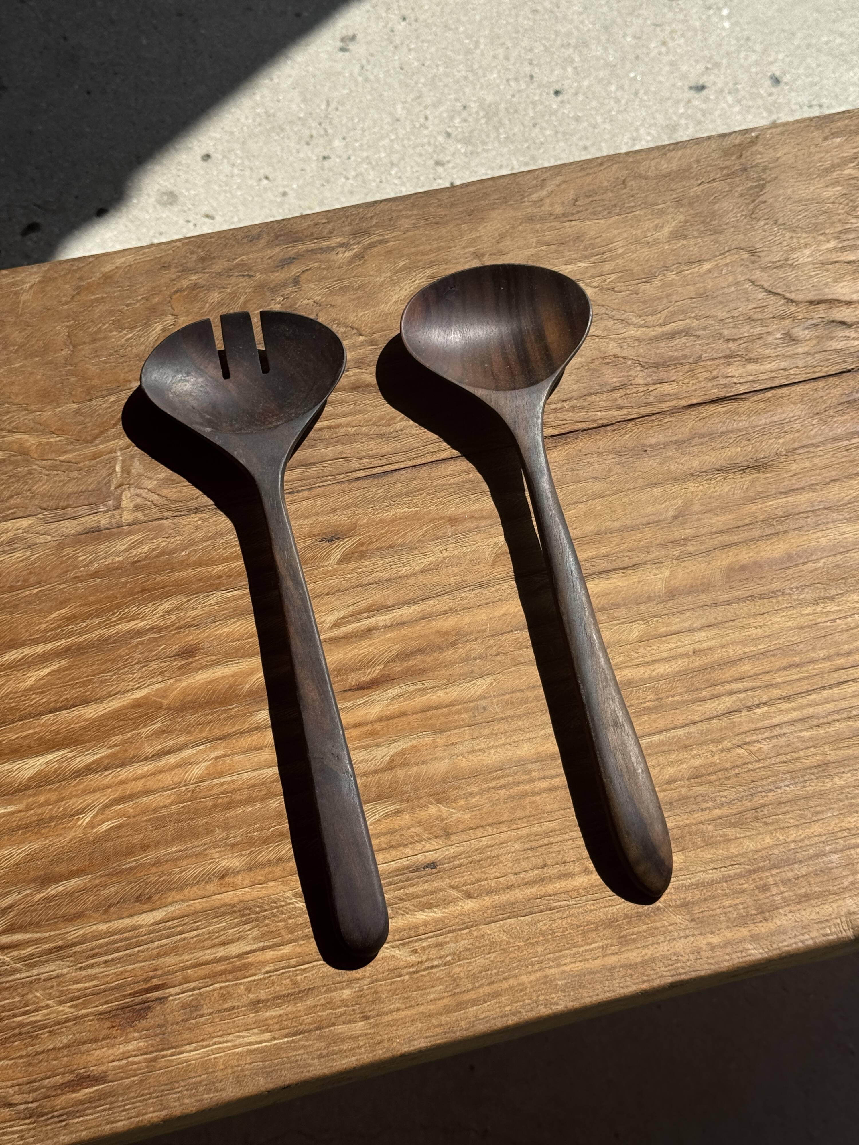 Pair of salad servers or kitchen utensils in blackened teak L30 D9