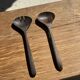 Pair of salad servers or kitchen utensils in blackened teak L30 D9