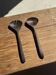 Pair of salad servers or kitchen utensils in blackened teak L30 D9