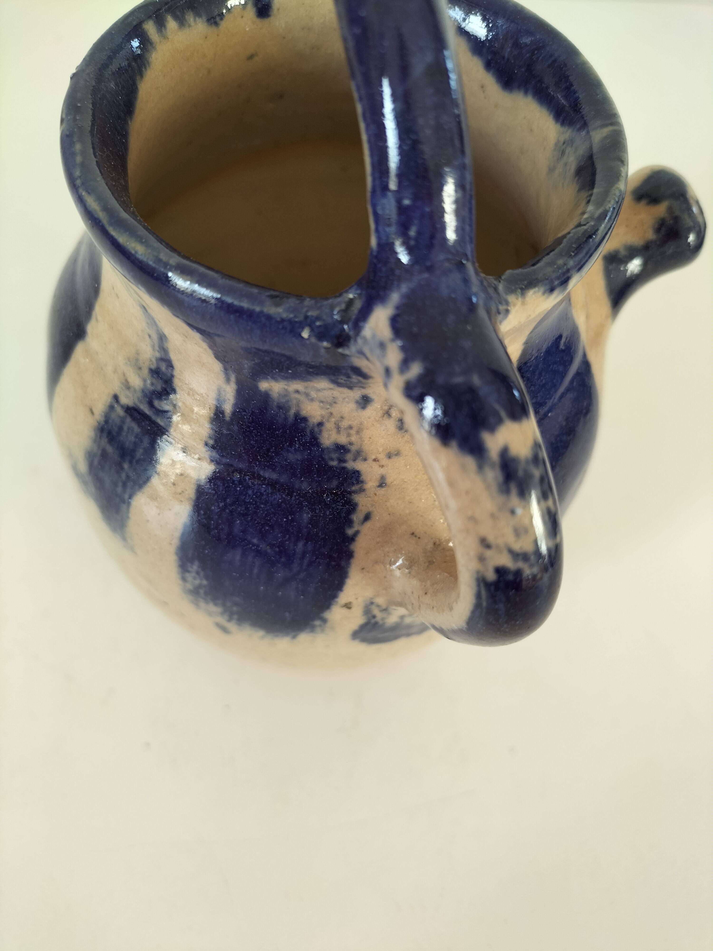 Old pitcher (goat) in cobalt glazed earthenware