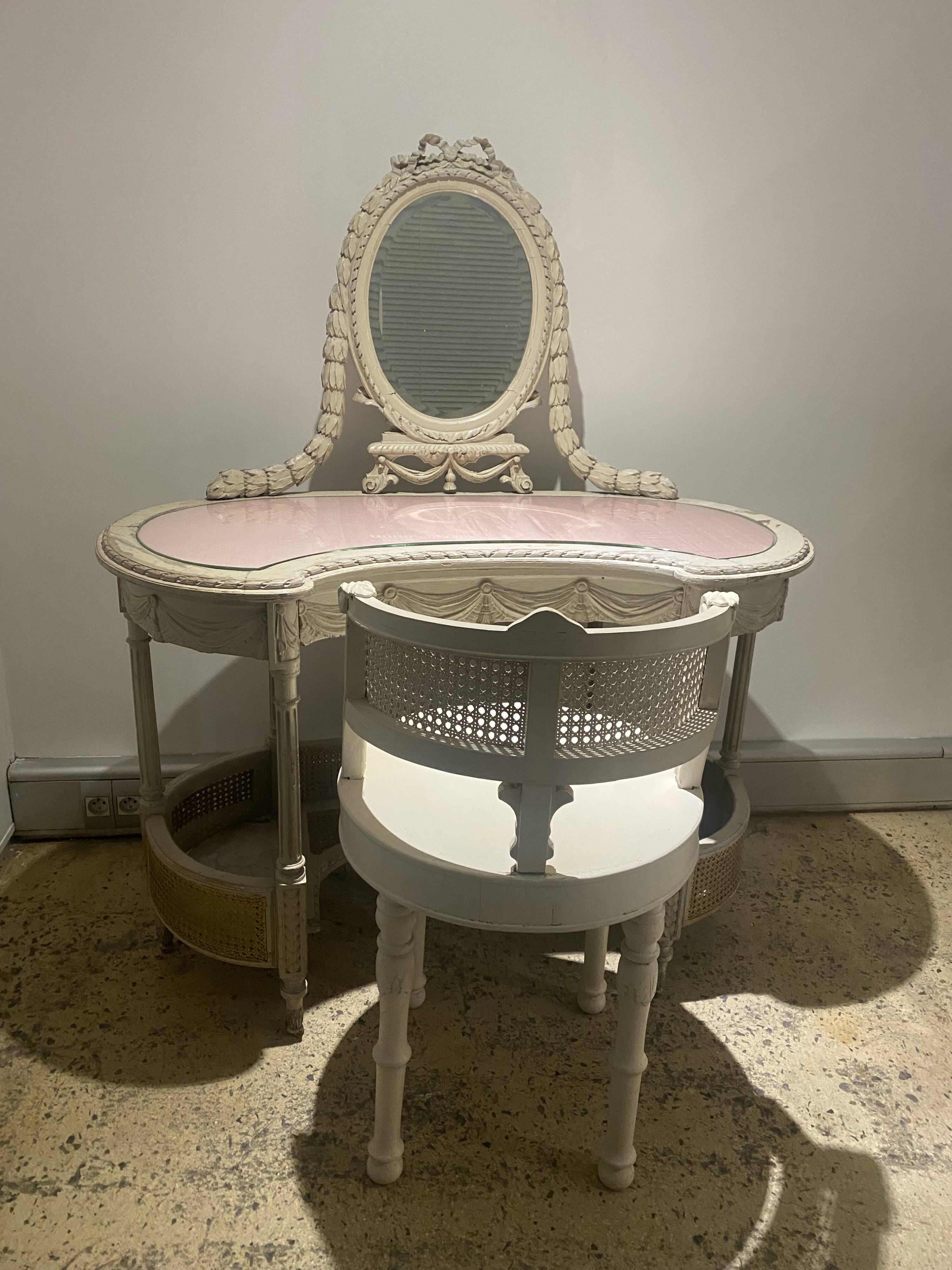 Hairdresser and her cane chair in Louis XVI style.