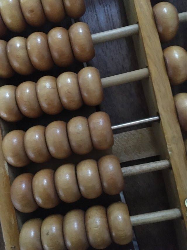 Vintage abacus made of light wood.