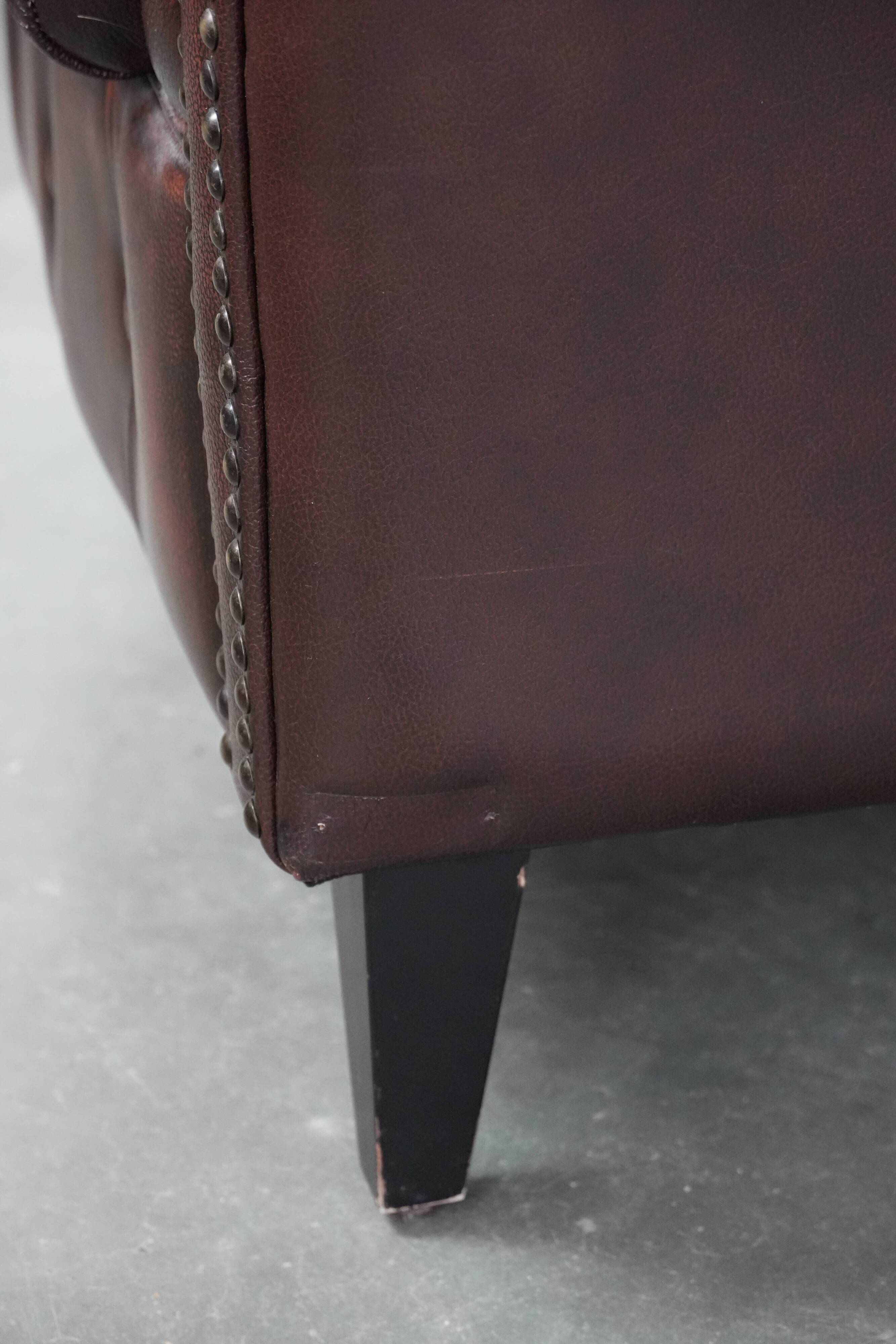 Set of three classic English-style Chesterfield cowhide  club armchairs