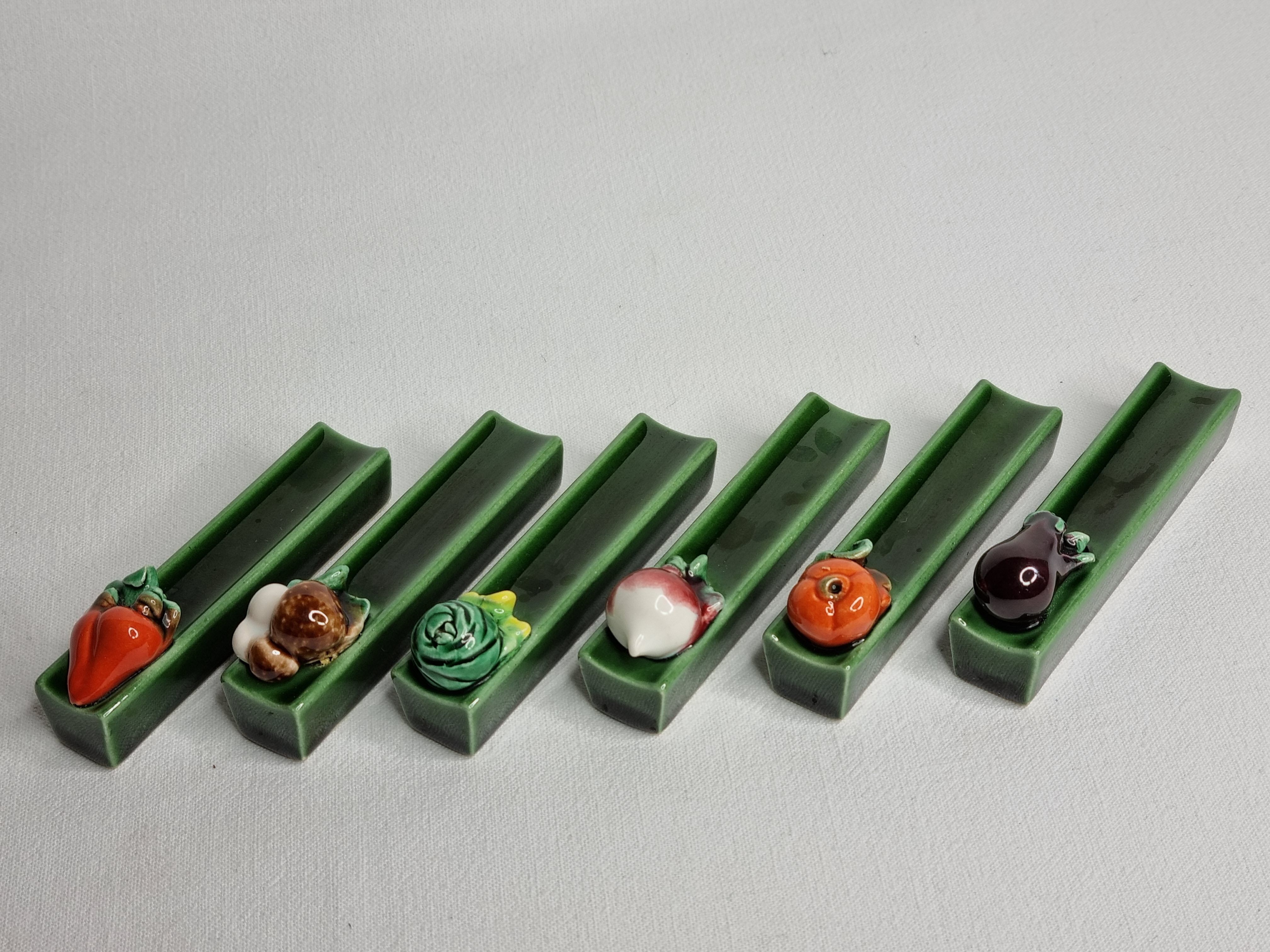 Set of six enamelled ceramic knife holders decorated with vegetables from the sun