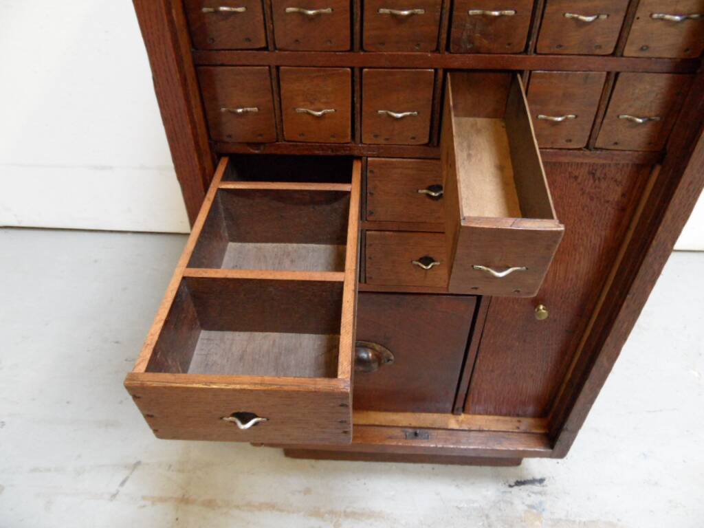 Antique watchmakers cabinet with drawers