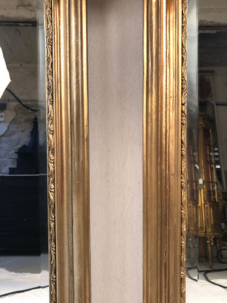 Pair of Louis XV style mirrors, stuccoed and gilded wood, beveled mirrors