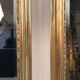 Pair of Louis XV style mirrors, stuccoed and gilded wood, beveled mirrors