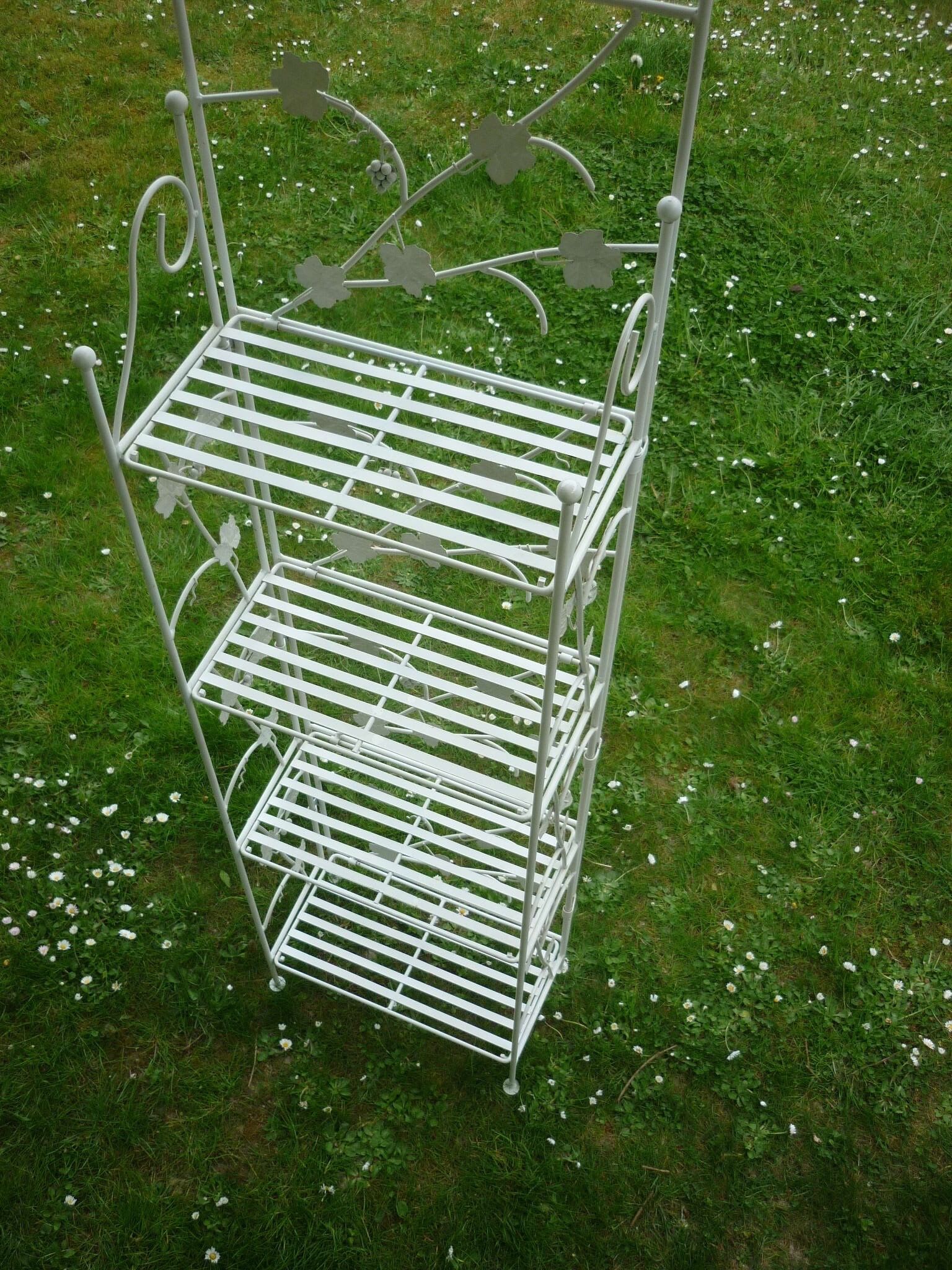Folding white wrought iron shelf