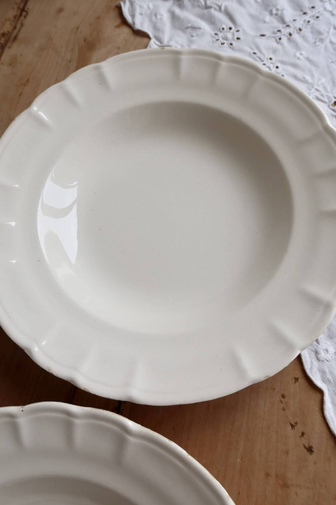 Pair of antique ivory faience deep plates ADP Luxcerae