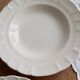 Pair of antique ivory faience deep plates ADP Luxcerae