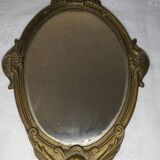 Old hand-facing mirror in gilded bronze