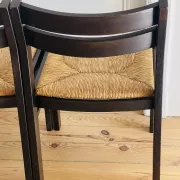 Pair of straw-seated wooden chairs in the regain style.