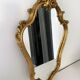 Old golden mirror in composite resin baroque style 60s