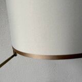 Floor lamp with articulated arm in brass-plated metal