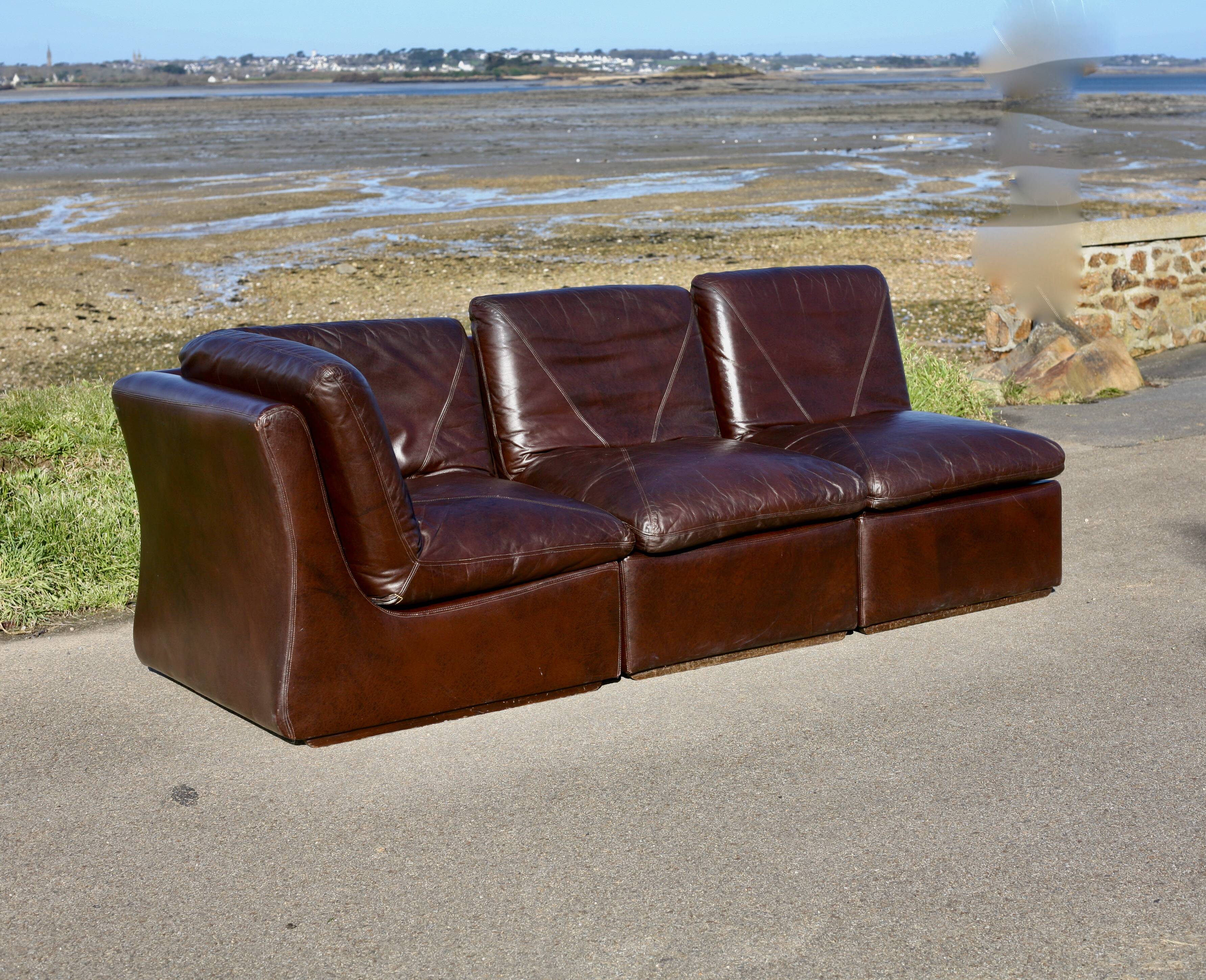 Modular sofa made up of 3 leather armchairs. Circa 1970
