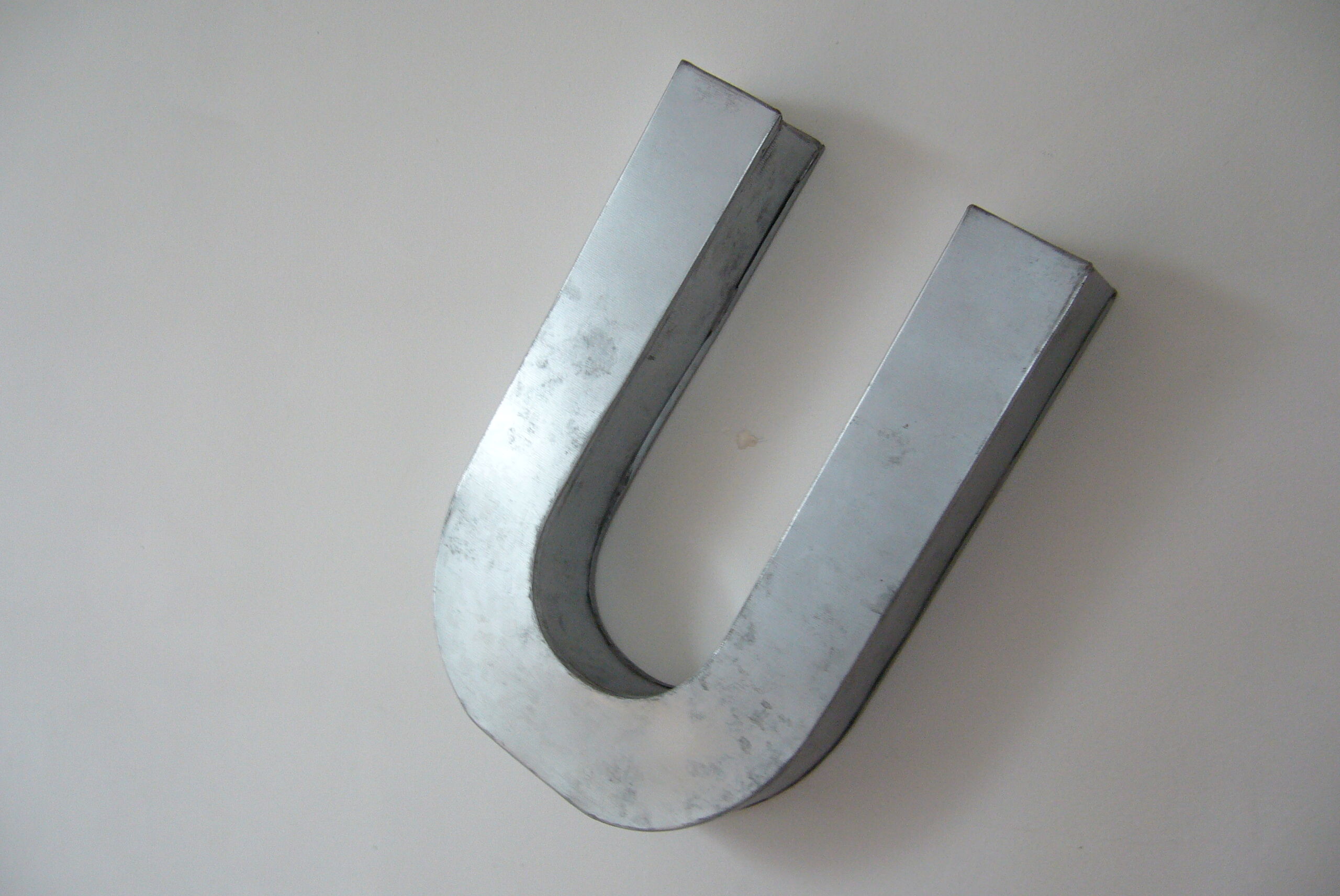 Letter U industrial white metal