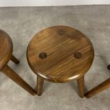 4 wooden tripod stools