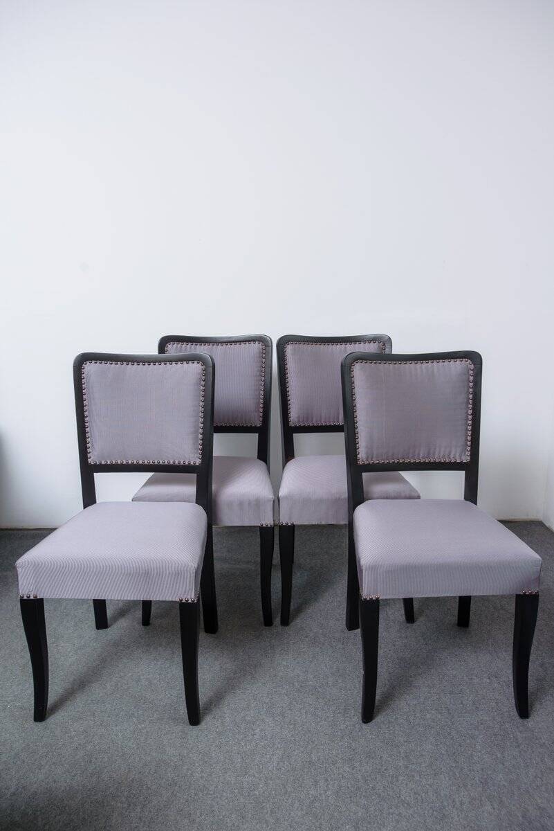 Set of 4 black and grey Art Deco chairs made of painted wood and upholstery fabric.