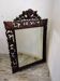 Antique carved wooden mirror
