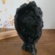 Sculpture visage en céramique noir