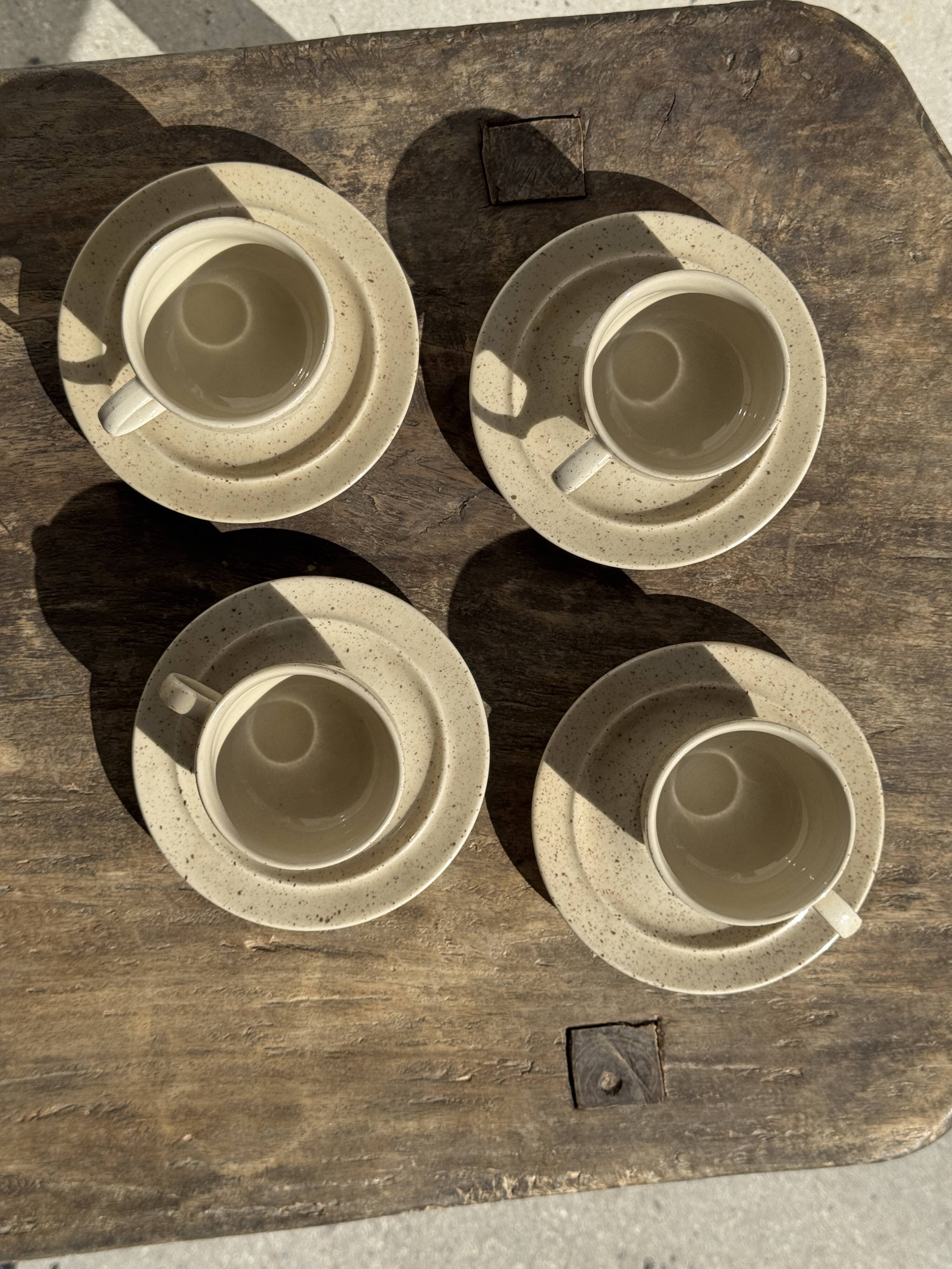 Set of 4 vintage speckled beige stoneware coffee cups.