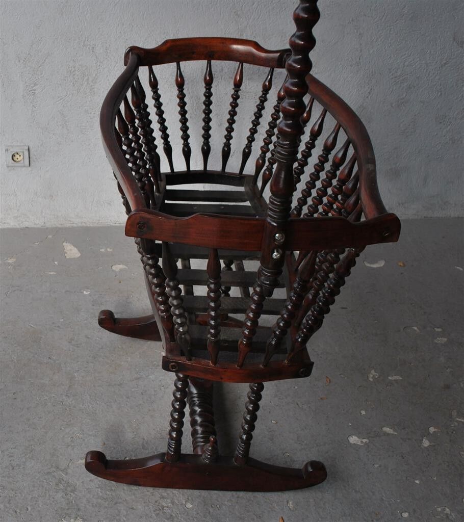 Old mahogany tinted exotic wooden cradle