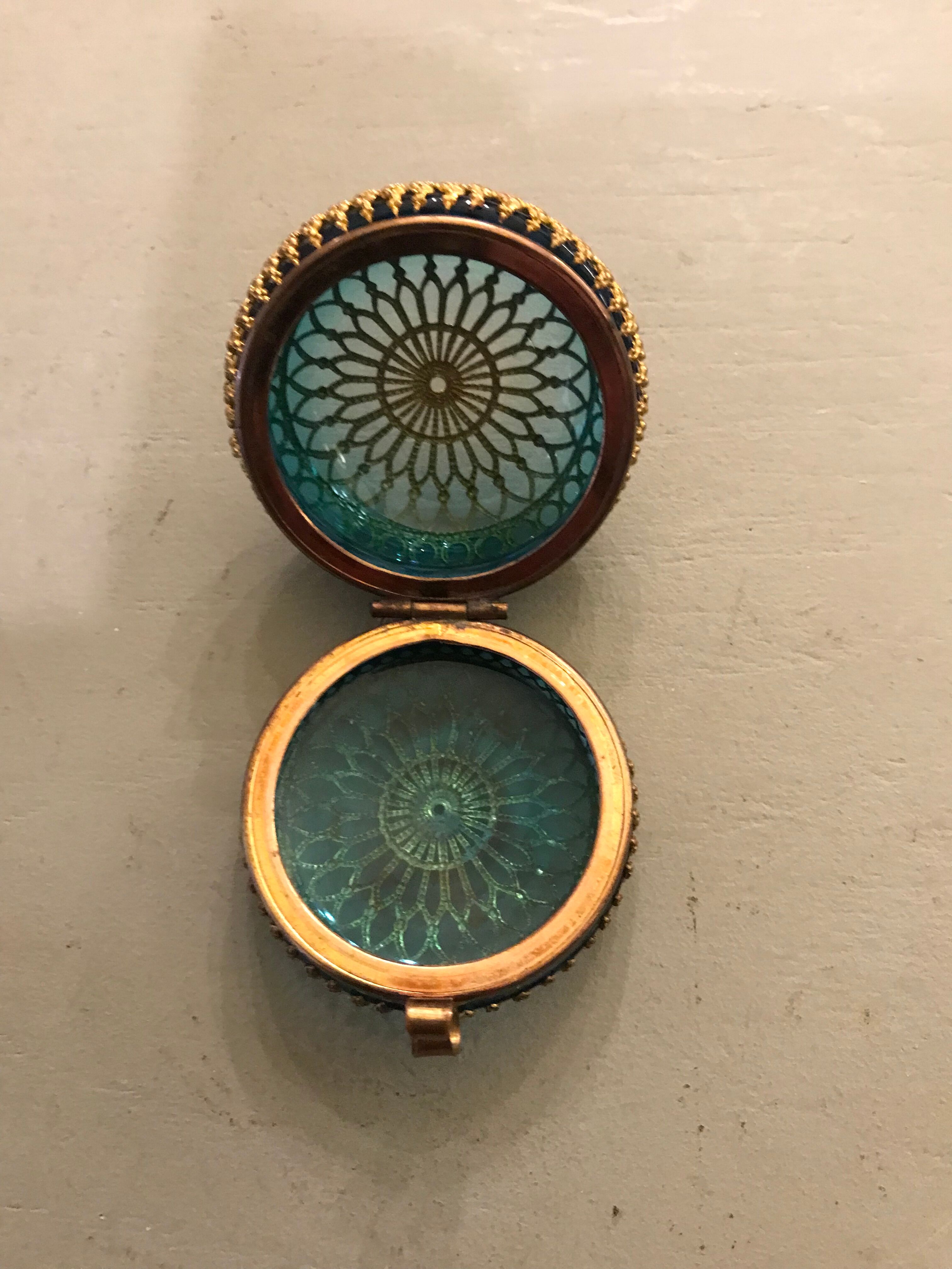 Old pill box made of golden thread