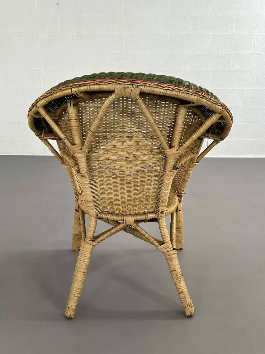 Rattan, wicker and green and red edging cabriolet style armchair