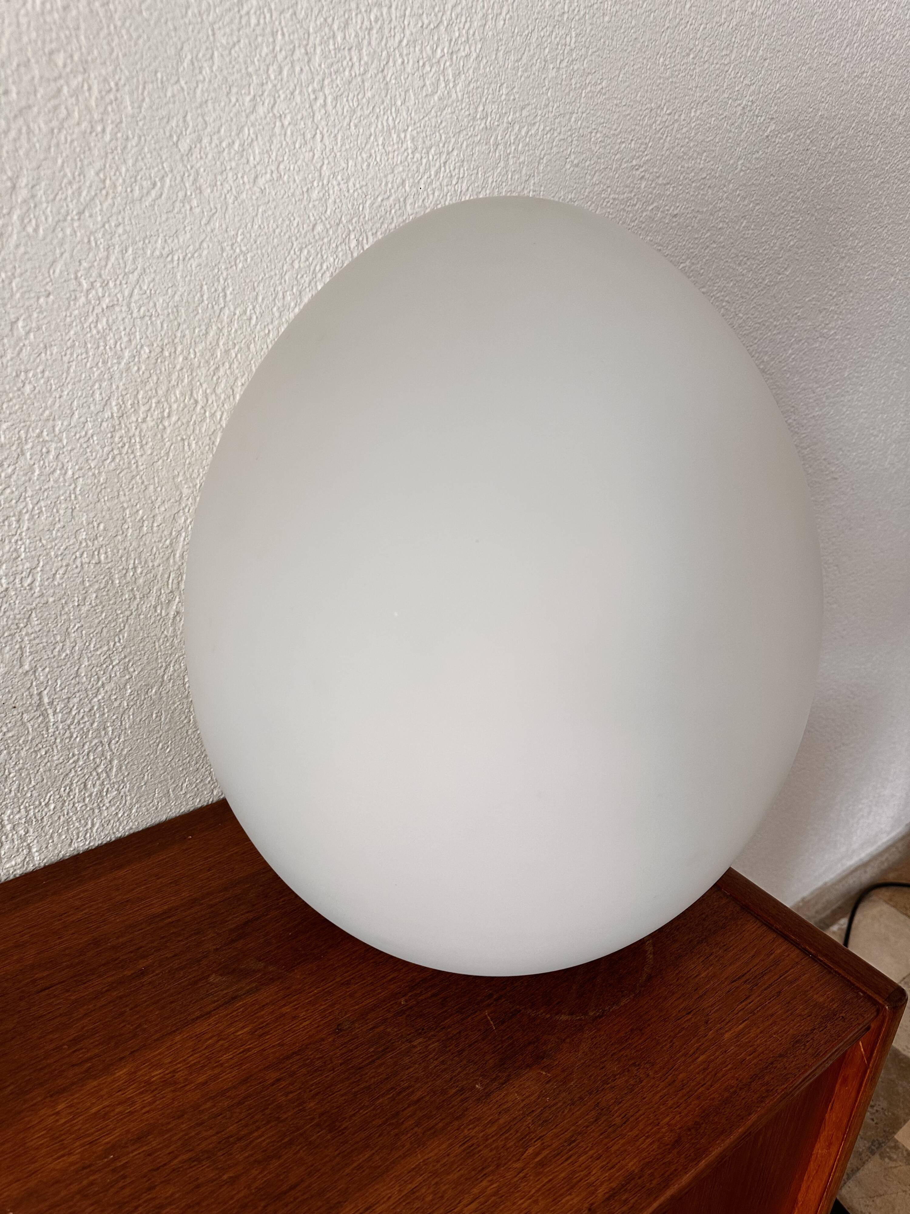 Two opal glass egg lamps