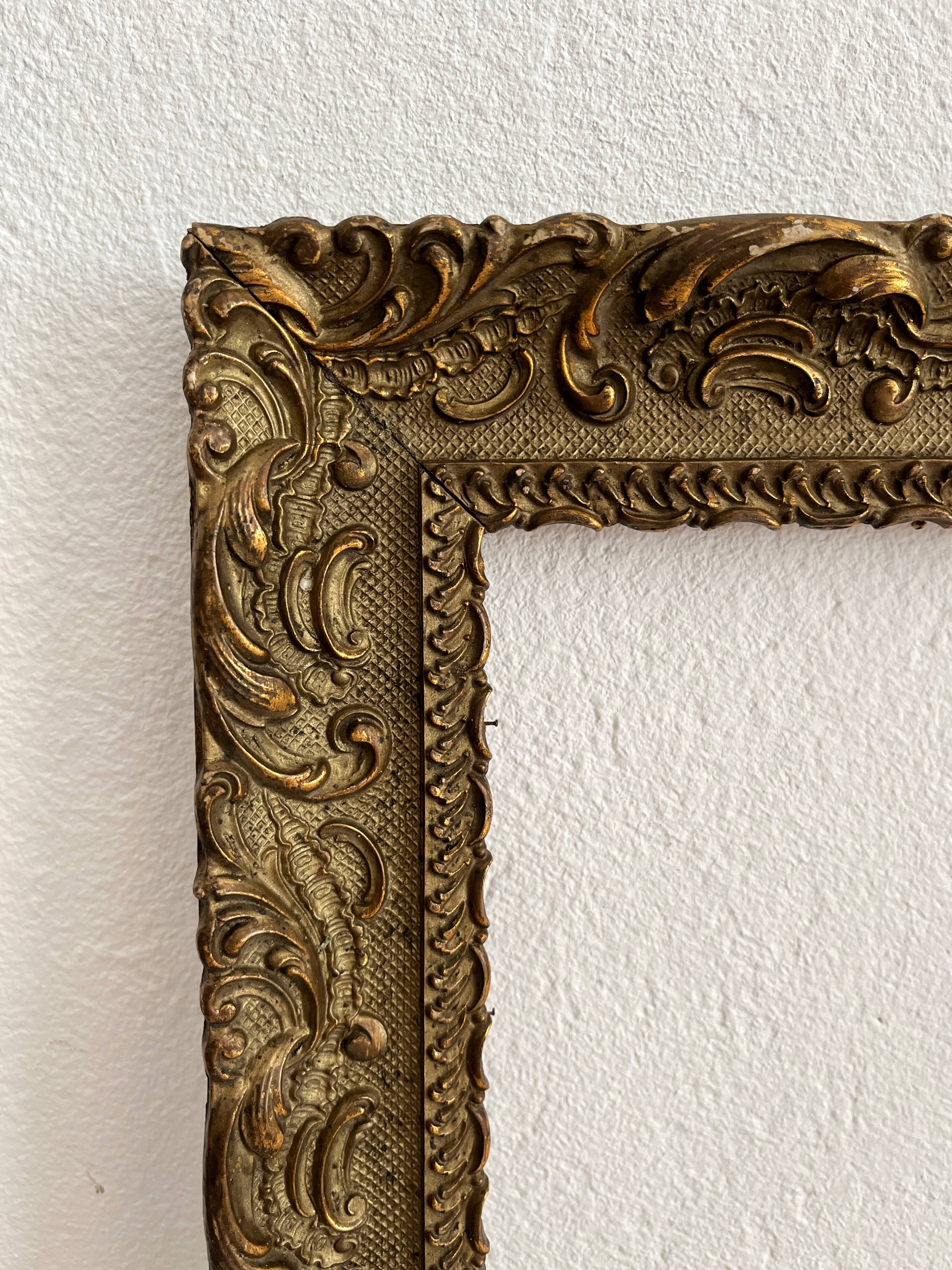 Old frame in gilded wood with stucco decoration circa 1900