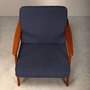 Pair Scandinavian Modern armchairs in teak and dark blue bouclé fabric