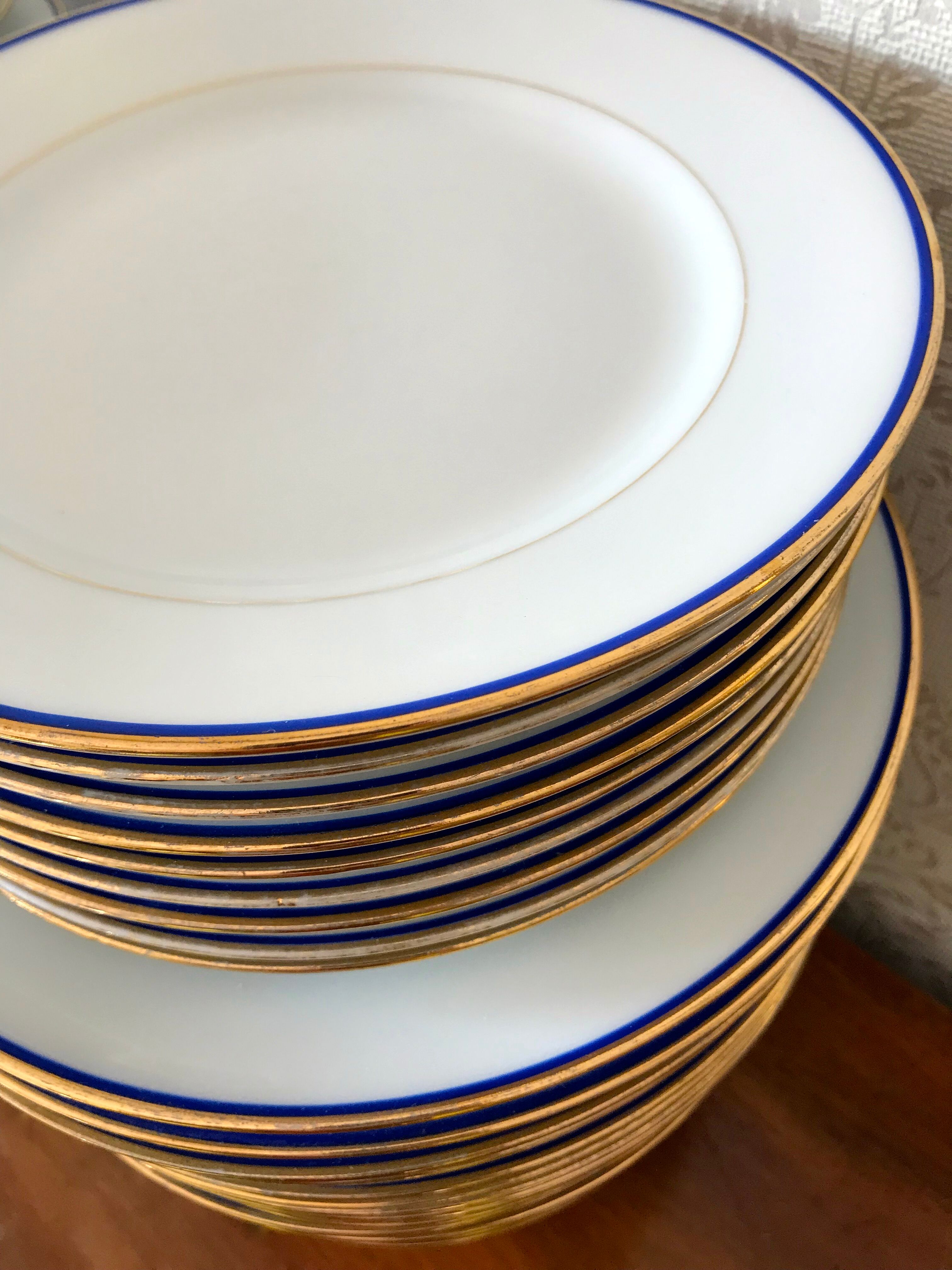 table service art deco limoges porcelain white border blue and gold 61 pieces signed