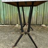 Vintage bistro table with an Art Deco style cast iron base and Formica top.