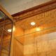 Vintage walnut burr buffet with glass and lighting, Art Deco style.