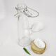 Glass bottle with clasp