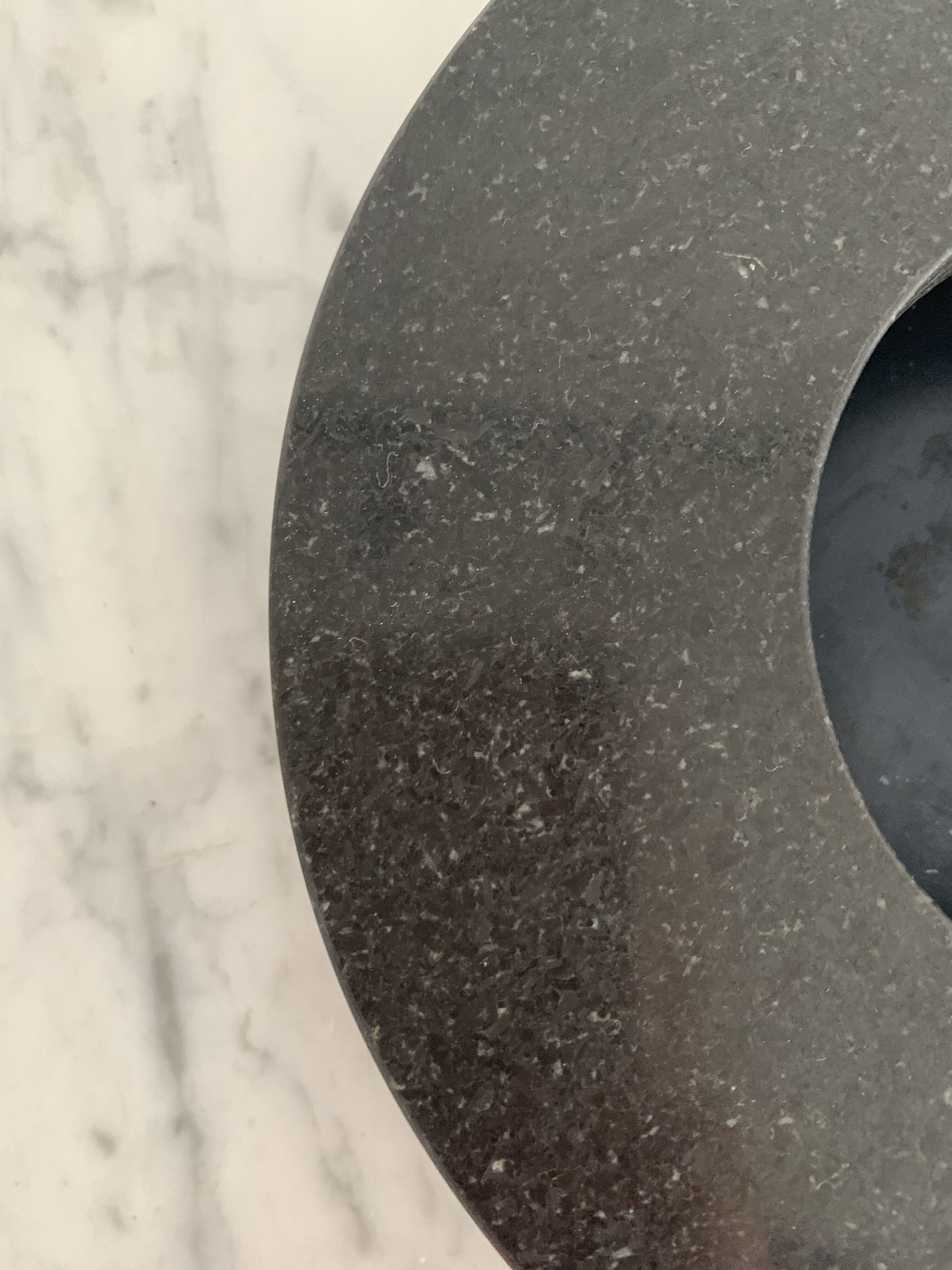 Grey-grey and black speckled marble round ashtray
