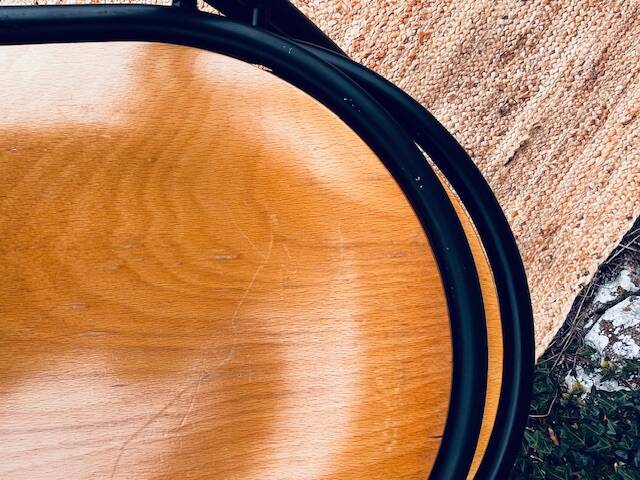 Pair of wooden and black metal chairs