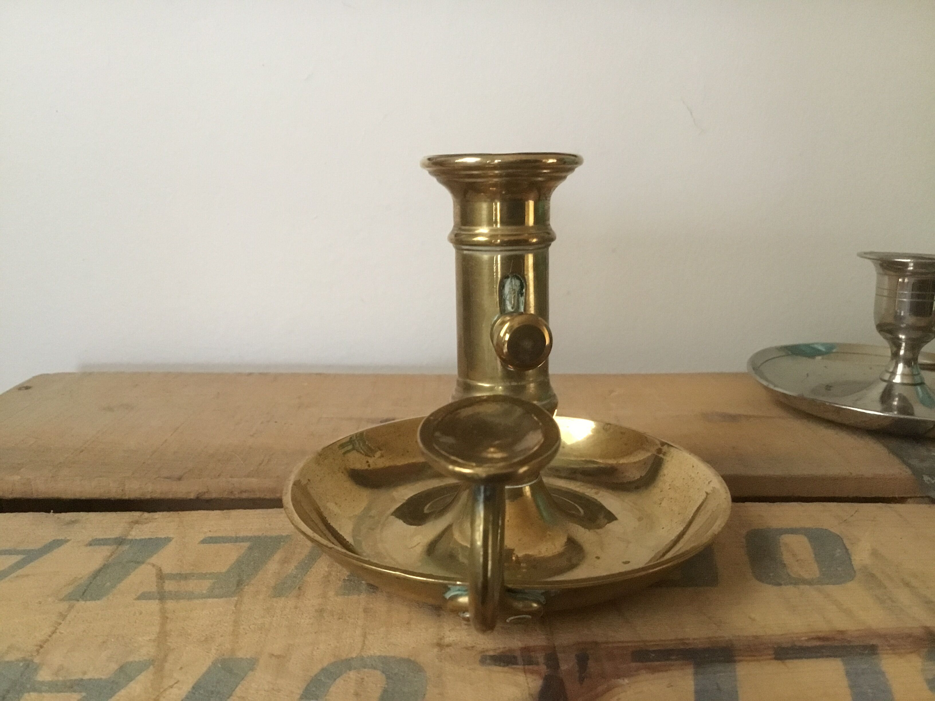 Thumb brass candlestick