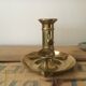 Thumb brass candlestick