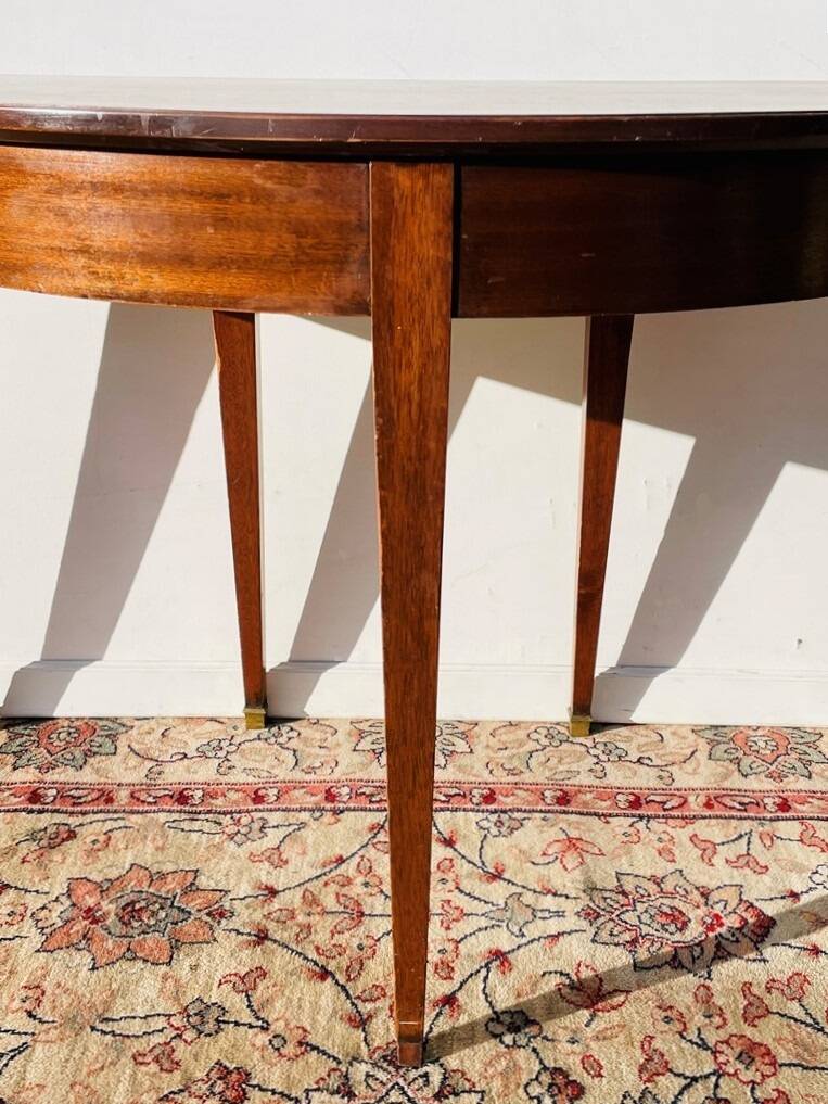Empire-style demi-lune console from the 19th century.