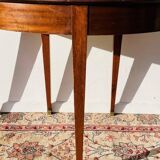 Empire-style demi-lune console from the 19th century.