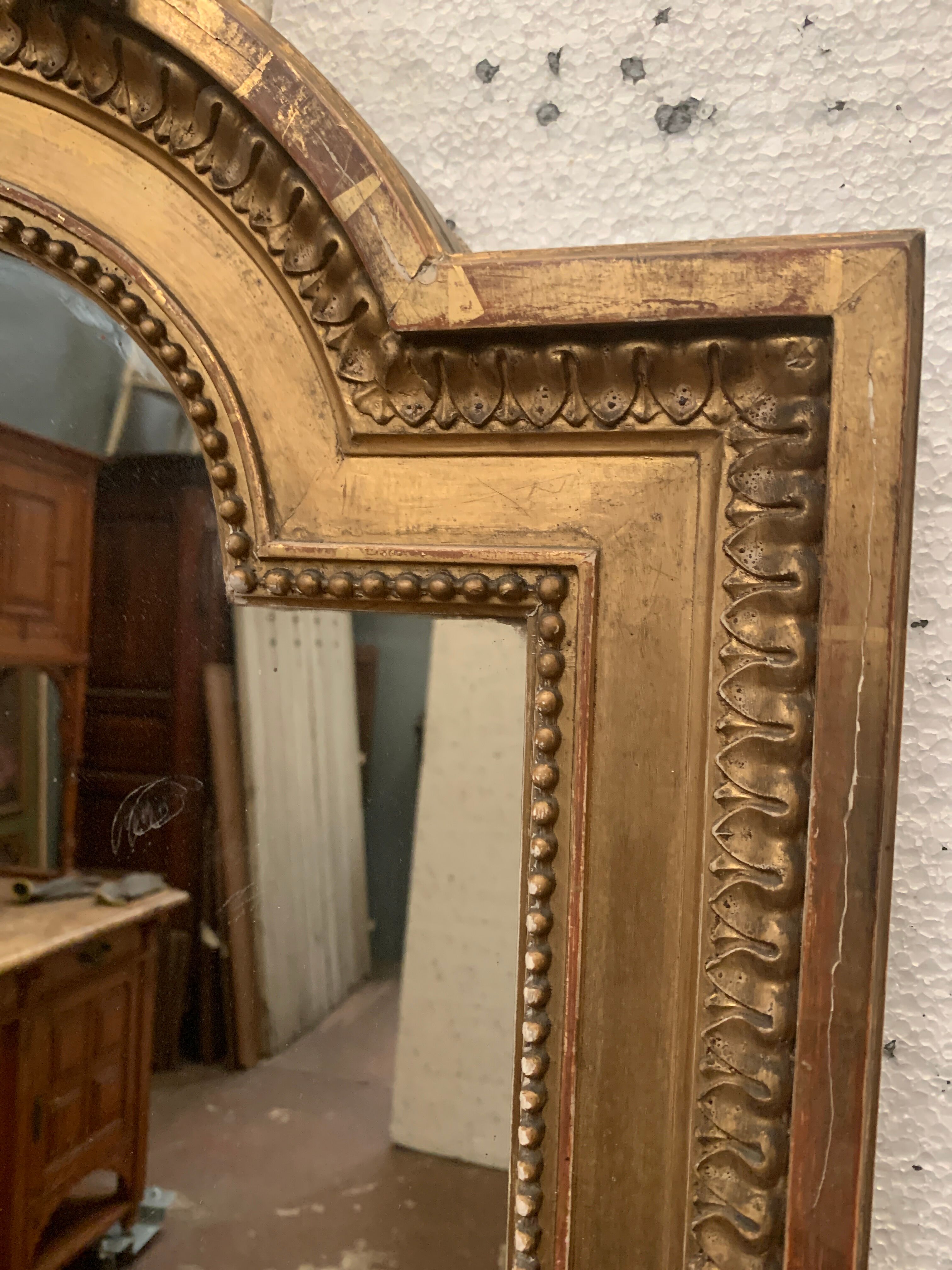Louis XVI style mirror in wood and gilded stucco XIX century