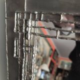 Tin mirror on brutalist wood support