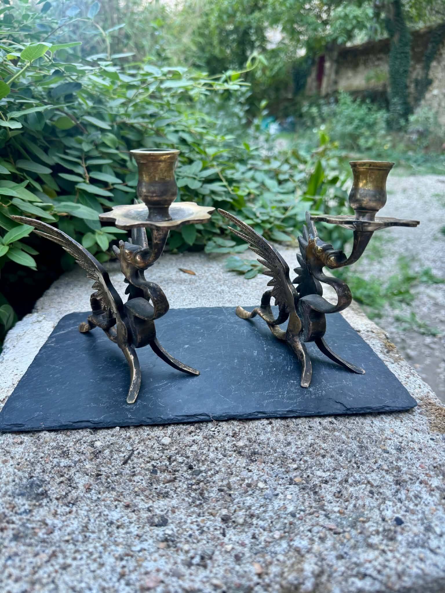 Pair of chimera candle holders in bronze, 19th century.